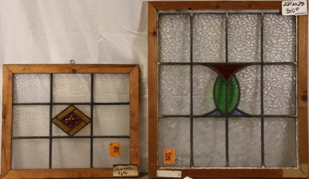 TWO ANTIQUE CONTINENTAL STAINED GLASS PANELS: Two antique Continental stained glass panels with multicolored stained glass medallions. Approximate dimensions: h. 22.5", w. 25" Disclaimer: This is an online court ordered bankruptcy sale. Participa