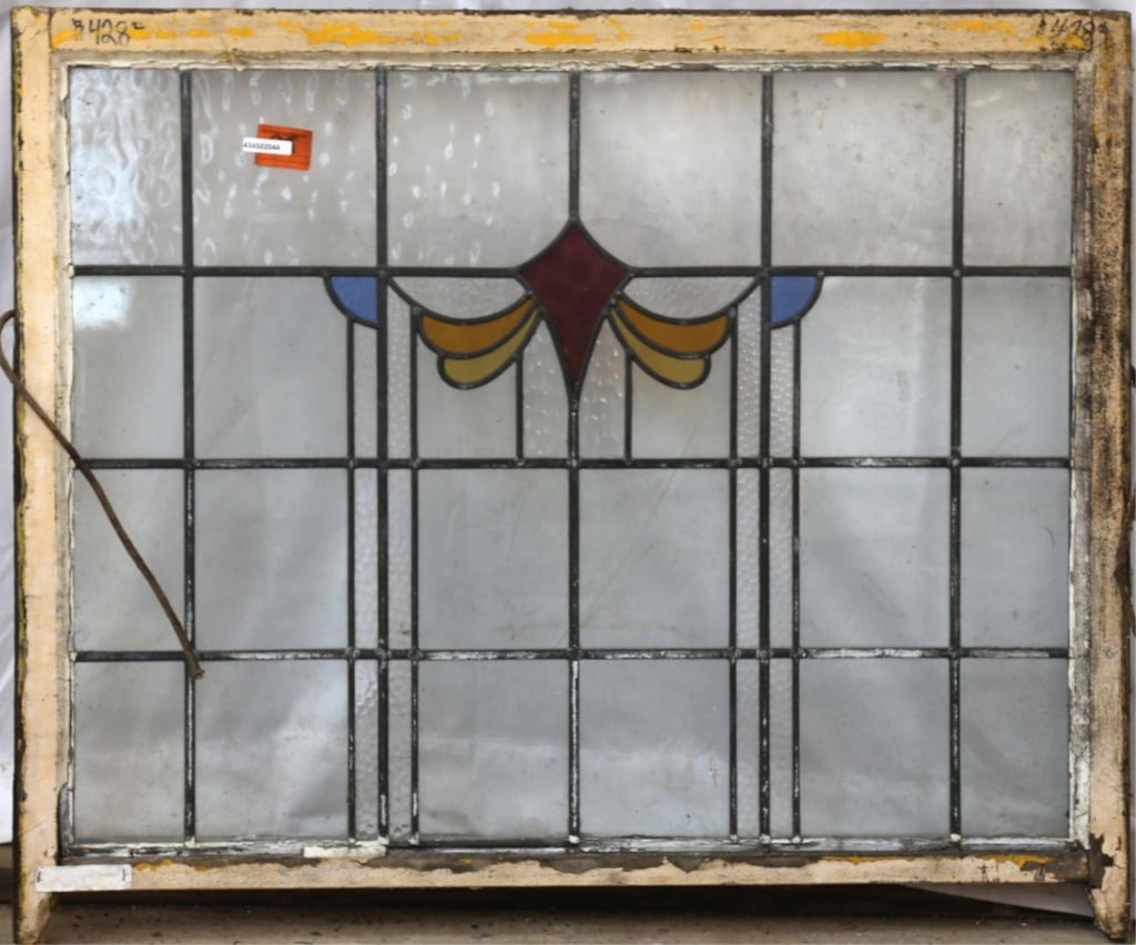 ANTIQUE CONTINENTAL STAINED GLASS PANEL: Antique Continental stained glass panel with red, amber, and blue medallion and colorless leaded glass panels, some textured. Approximate dimensions: h. 34.5", w. 40.5" Disclaimer: This is an online c