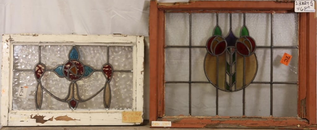 TWO FRENCH ART NOUVEAU STAINED GLASS PANELS: Two French Art Nouveau stained glass panels, one with floral medallions and etched colorless details, the other with garland motif. Approximate dimensions: h. 23", w. 29.5" Disclaimer: This is an onli