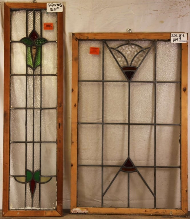TWO ANTIQUE CONTINENTAL STAINED GLASS PANELS: Two antique Continental stained glass panels, one with floral elements and the other with geometric details. Approximate dimensions: h. 39", w. 25" Disclaimer: This is an online court ordered bankrupt