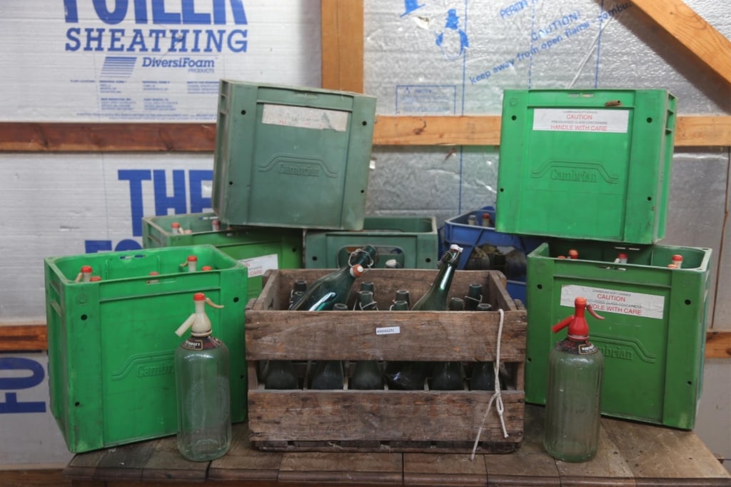 ANTIQUE CONTINENTAL WINE & SELTZER BOTTLES: Seven cases of antique Continental wine and seltzer bottles. Disclaimer: This is an online court ordered bankruptcy sale. Participating bidders must have a credit card on file with Live Auctioneers. C