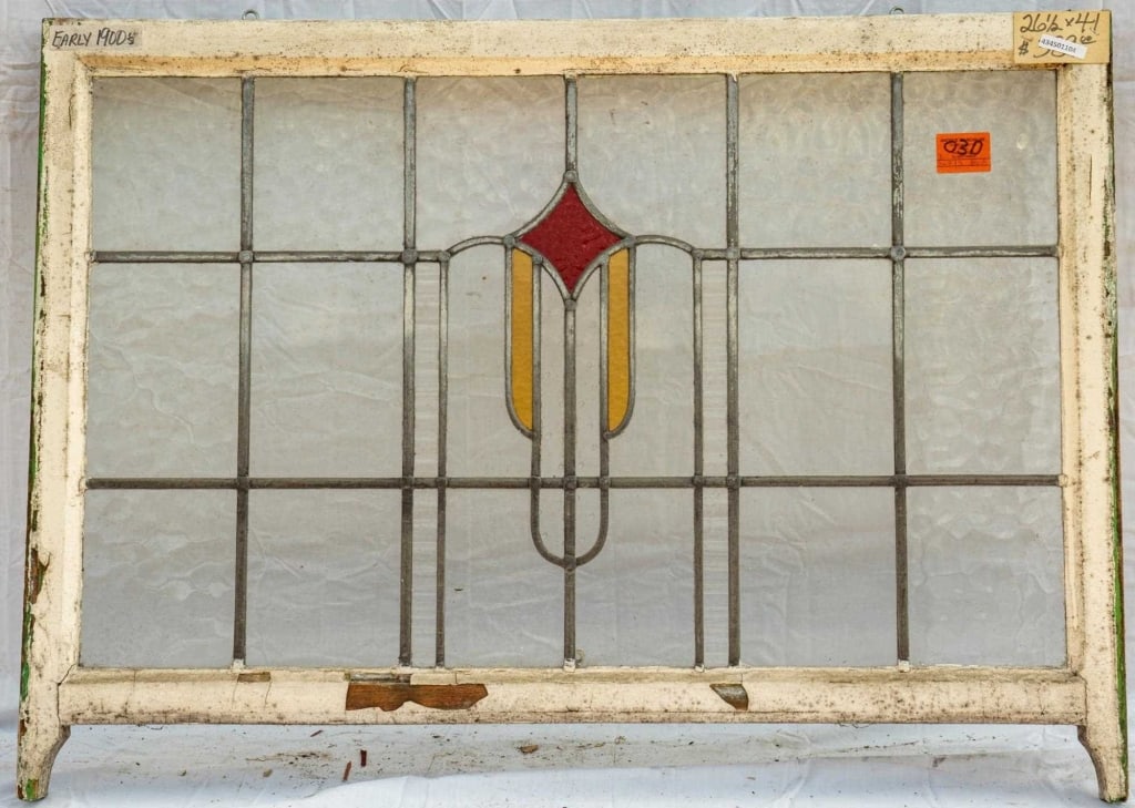 FRENCH ART DECO STAINED GLASS PANEL: French Art Deco stained glass panel with red and yellow medallion. Approximate dimensions: h. 26.5", w. 41" Disclaimer: This is an online court ordered bankruptcy sale. Participating bidders must have