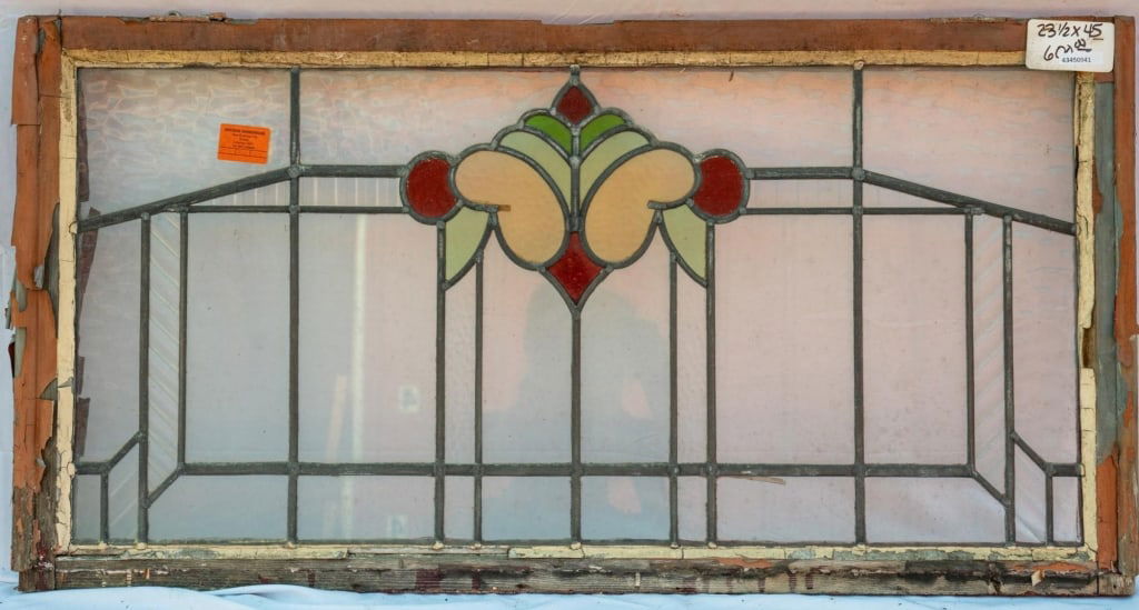FRENCH ART NOUVEAU STAINED GLASS PANEL: French Art Nouveau stained glass panel with a floral motif set within colorless textured leaded glass panels. Approximate dimensions: h. 23.5", w. 45" Disclaimer: This is an online court ordered bankr