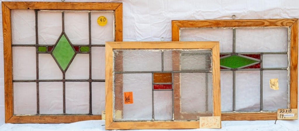 THREE FRENCH ART DECO STAINED GLASS PANELS: Three French Art Deco stained glass panels with geometric medallions. Approximate dimensions: h. 20", w. 21" Disclaimer: This is an online court ordered bankruptcy sale. Participating bidders must hav