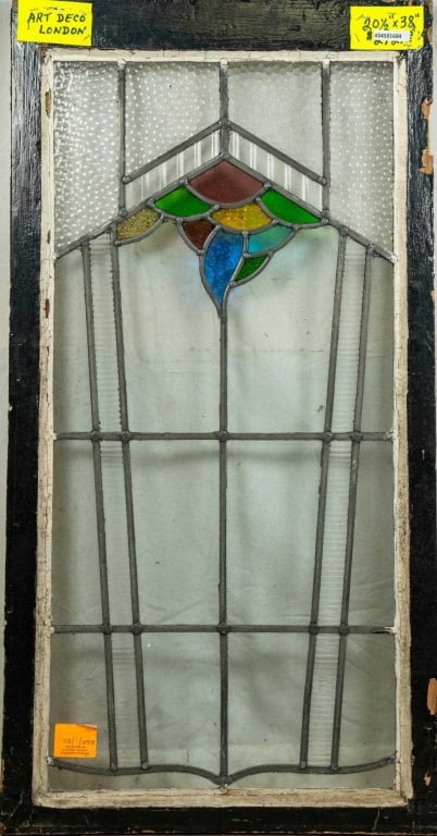 ENGLISH ART DECO STAINED GLASS PANEL: English Art Deco stained glass panel with a multicolored geometric medallion. Approximate dimensions: h. 38", w. 20.5" Disclaimer: This is an online court ordered bankruptcy sale. Participating bidder