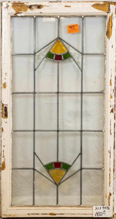 FRENCH ART DECO STAINED GLASS PANEL: French Art Deco stained glass panel with triangular geometric glass accents. Approximate dimensions: h. 39.5", w. 21" Disclaimer: This is an online court ordered bankruptcy sale. Participating bidders