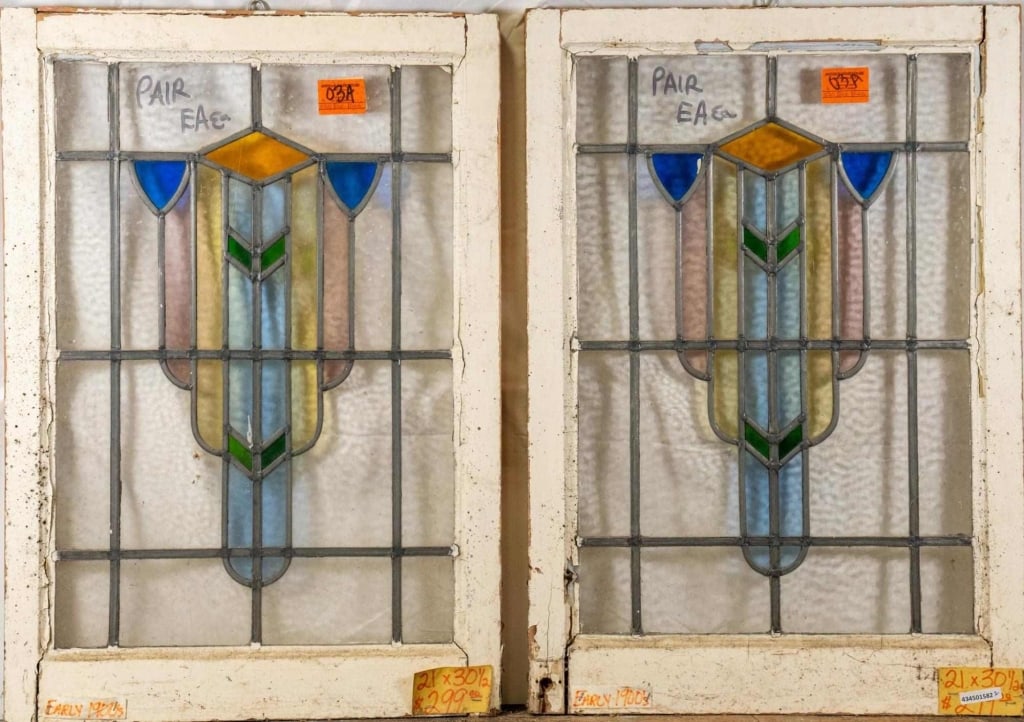 PAIR OF FRENCH ART DECO STAINED GLASS PANELS: Pair of French Art Deco stained glass panels with geometric multicolored medallions. Approximate dimensions: h. 30.5", w. 21" Disclaimer: This is an online court ordered bankruptcy sale. Participating