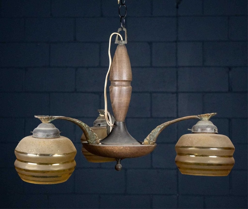 FRENCH ART DECO 3-LIGHT CHANDELIER: French Art Deco 3-light chandelier with matte and gloss amber cut glass shades, bronze, and wood details. Approximate dimensions: h. 15", w. 22" Disclaimer: This is an online court ordered bankruptcy