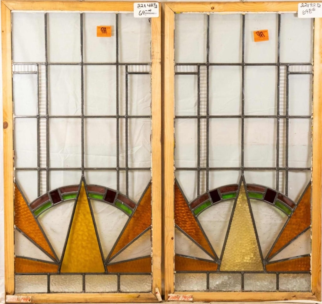 PAIR OF FRENCH ART DECO STAINED GLASS PANELS: Pair of French Art Deco stained glass panels, decorated with geometric multicolored accents, including some textured. Approximate dimensions: h. 42.5", w. 22" Disclaimer: This is an online court order