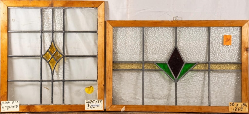 TWO ENGLISH ART DECO STAINED GLASS PANELS: Two English Art Deco stained glass panels with geometric multicolored accents. Approximate dimensions: h. 22", w. 20.5" Disclaimer: This is an online court ordered bankruptcy sale. Participating bidde