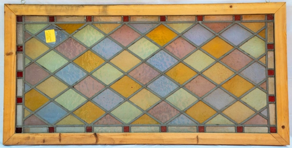 FRENCH ART NOUVEAU STAINED GLASS PANEL: French Art Nouveau stained glass panel with a checkerboard pattern in pink, amber, purple, and chartreuse stained glass. Approximate dimensions: h. 22", w. 44" Disclaimer: This is an online court orde