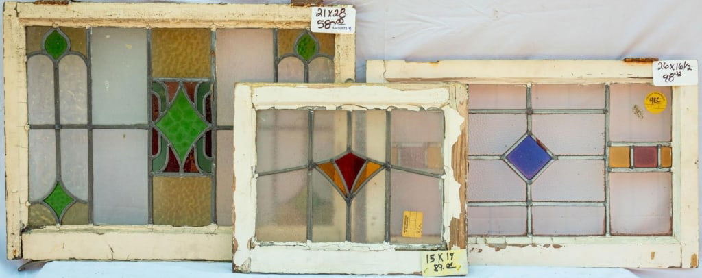 THREE FRENCH STAINED GLASS PANELS: Three French stained glass panels with a geometric motif. Approximate dimensions: h. 21", w. 28" Disclaimer: This is an online court ordered bankruptcy sale. Participating bidders must have a credit c