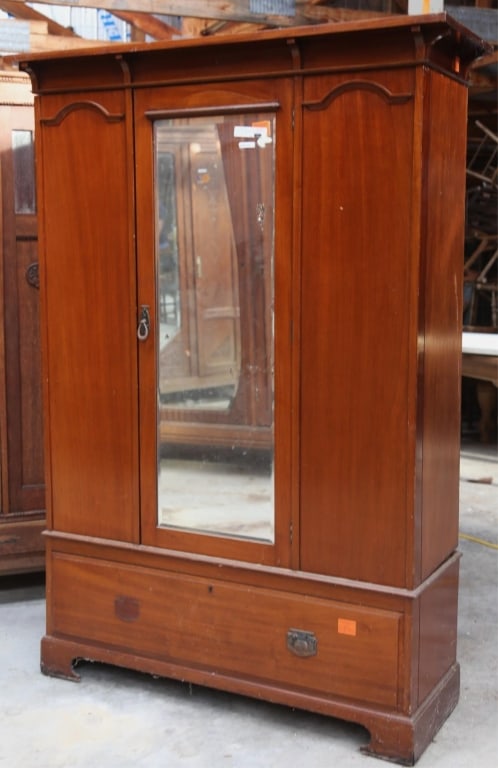 ENGLISH ART DECO MIRRORED ARMOIRE: English Art Deco mirrored armoire with a beveled mirror. Approximate dimensions: h. 77", w. 53", d. 20.5" Disclaimer: This is an online court ordered bankruptcy sale. Participating bidders must have a