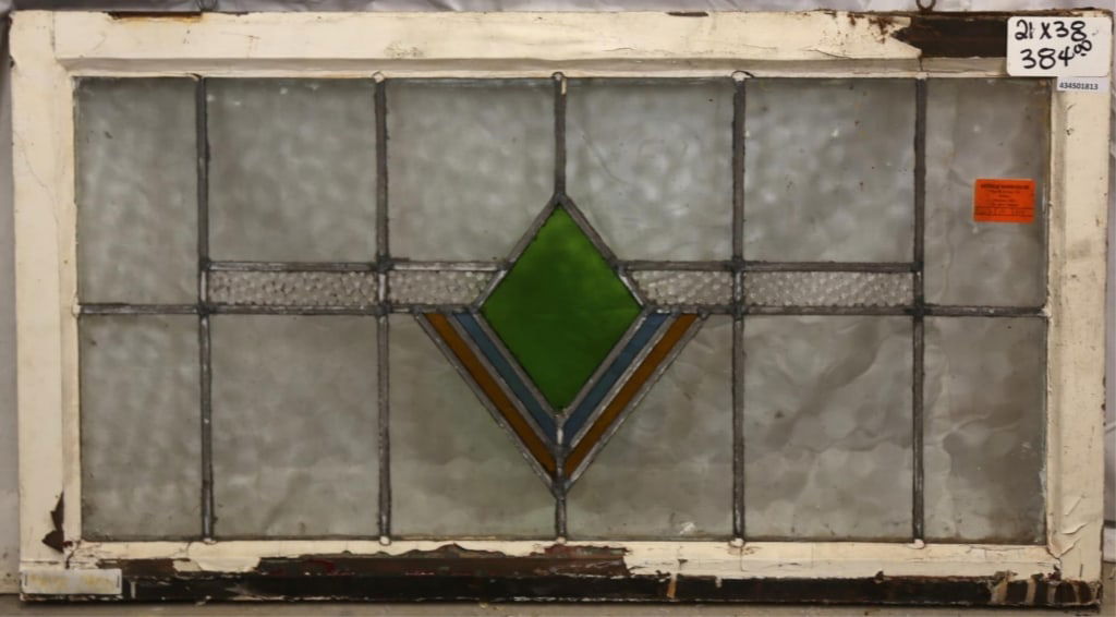 FRENCH ART DECO STAINED GLASS PANEL: French Art Deco stained glass panel with geometric medallion and amber, green, and blue accents. Approximate dimensions: h. 21", w. 38" Disclaimer: This is an online court ordered bankruptcy sale. Par