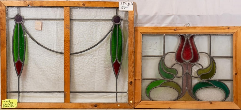 TWO CONTINENTAL STAINED GLASS PANELS: Two Continental stained glass panels with floral and botanical motifs. Approximate dimensions: h. 25.5", w. 31.5" Disclaimer: This is an online court ordered bankruptcy sale. Participating bidders mus