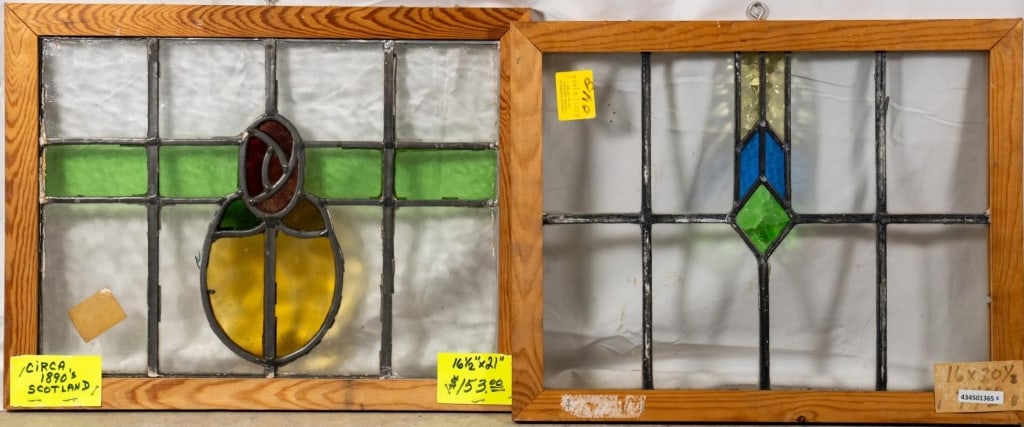 TWO CONTINENTAL STAINED GLASS PANELS: Two Continental stained glass panels with floral and geometric motifs. Approximate dimensions: h. 16.5", w. 21" Disclaimer: This is an online court ordered bankruptcy sale. Participating bidders must