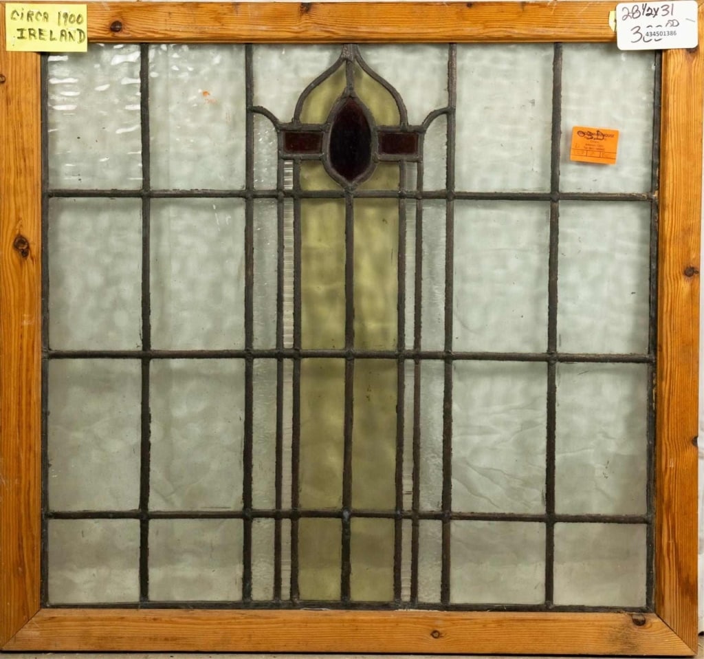IRISH ART DECO STAINED GLASS PANEL: Irish Art Deco stained glass panel. Approximate dimensions: h. 28.5",w. 31" Disclaimer: This is an online court ordered bankruptcy sale. Participating bidders must have a credit card on file with Live