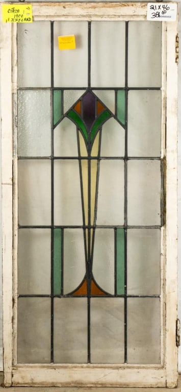 IRISH ART DECO STAINED GLASS PANEL: Irish Art Deco stained glass panel with geometric multicolored medallion. Approximate dimensions: h. 46", w. 21" Disclaimer: This is an online court ordered bankruptcy sale. Participating bidders must