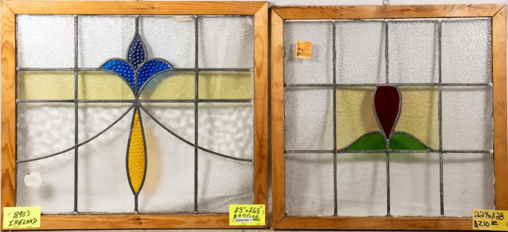 TWO CONTINENTAL STAINED GLASS PANELS: Two Continental stained glass panels with textured stained glass details. Approximate dimensions: h. 23", w. 26.5" Disclaimer: This is an online court ordered bankruptcy sale. Participating bidders mu