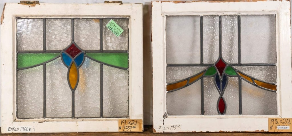 TWO CONTINENTAL STAINED GLASS PANELS: Two Continental stained glass panels with multicolored glass accents. Approximate dimensions: h. 19, w. 21" Disclaimer: This is an online court ordered bankruptcy sale. Participating bidders must have