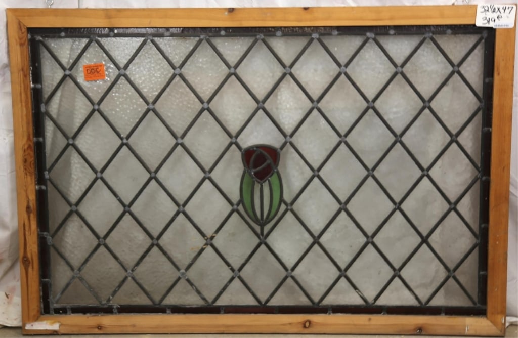ANTIQUE ENGLISH STAINED GLASS PANEL: Antique English stained glass panel with rose and leaves medallion and colorless leaded glass panels. Approximate dimensions: h. 32.5", w. 47" Disclaimer: This is an online court ordered bankruptcy sa