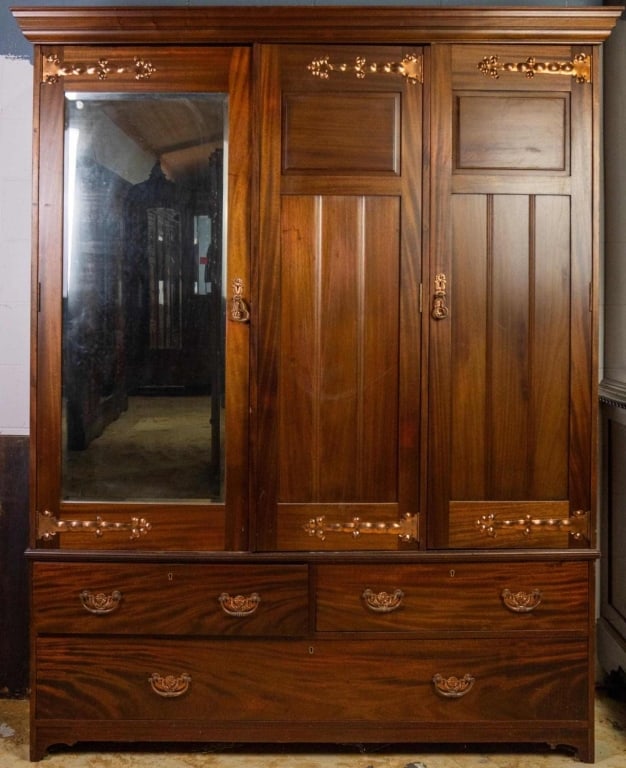 ENGLISH MAHOGANY TRIPLE ARMOIRE: English mahogany triple armoire with copper-forged hinges and beveled mirror. Approximate dimensions: h. 79", w. 60", d. 20" Disclaimer: This is an online court ordered bankruptcy sale. Participating 