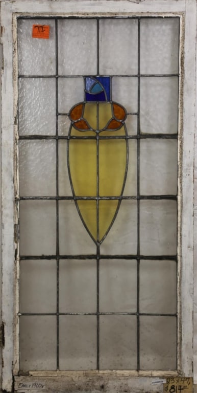 ANTIQUE CONTINENTAL STAINED GLASS PANEL: Antique Continental stained glass panel with medallion in amber, canary yellow, and blue Approximate dimensions: h. 47", w. 23" Disclaimer: This is an online court ordered bankruptcy sale. Participati