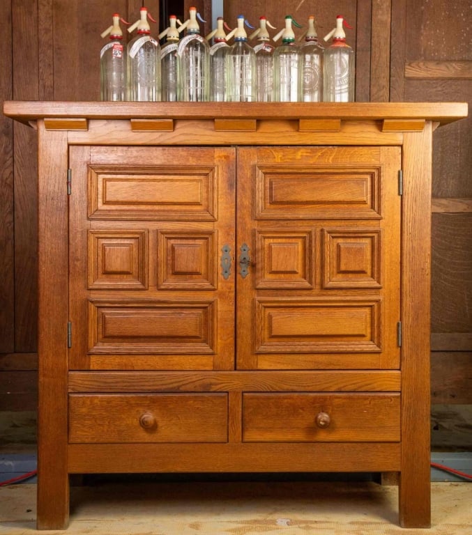 FRENCH COUNTRY OAK WINE CABINET: French country oak wine cabinet with inset carved panels. Approximate dimensions: h. 49", w. 52", d. 20" Disclaimer: This is an online court ordered bankruptcy sale. Participating bidders must have a