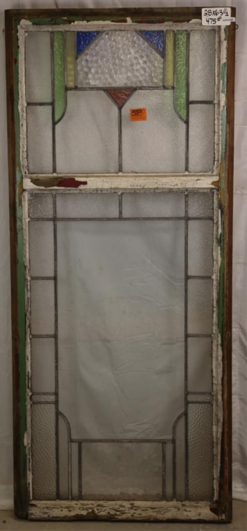 ENGLISH ART DECO STAINED GLASS PANEL: English Art Deco stained glass panel with green, yellow, blue, and purple accent details. Approximate dimensions: h. 63.5", w. 28" Disclaimer: This is an online court ordered bankruptcy sale. Particip