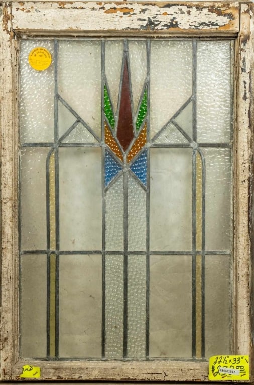 ENGLISH ART DECO STAINED GLASS PANEL: English Art Deco stained glass panel with geometric multicolored medallion. Approximate dimensions: h. 33", w. 22.5" Disclaimer: This is an online court ordered bankruptcy sale. Participating bidders