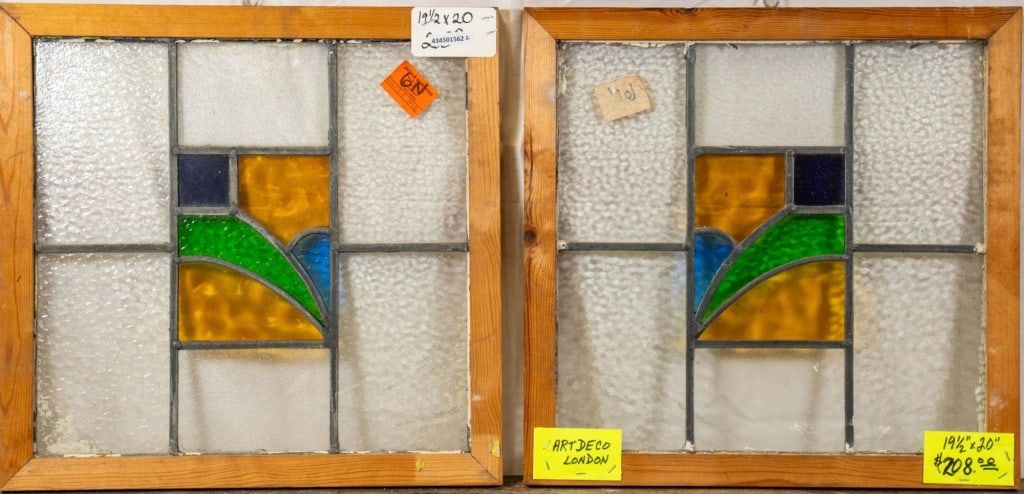 PAIR OF ENGLISH ART DECO STAINED GLASS PANELS: Pair of English Art Deco stained glass panels with geometric blue, yellow, and green medallions. Approximate dimensions: h. 19.5", w. 20" Disclaimer: This is an online court ordered bankruptcy sale. P