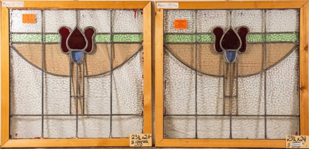 PAIR OF FRENCH ART NOUVEAU STAINED GLASS PANELS: Pair of French Art Nouveau stained glass panels with red floral medallions and blue wispy glass accents. Approximate dimensions: h. 23.5", w. 24" Disclaimer: This is an online court ordered bankruptcy