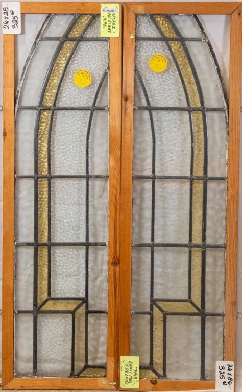 PAIR OF IRISH STAINED GLASS PANELS: Pair of Irish stained glass panels with amber and colorless textured leaded glass panels. Approximate dimensions: h. 43.5", w. 13.5" Disclaimer: This is an online court ordered bankruptcy sale. Partic