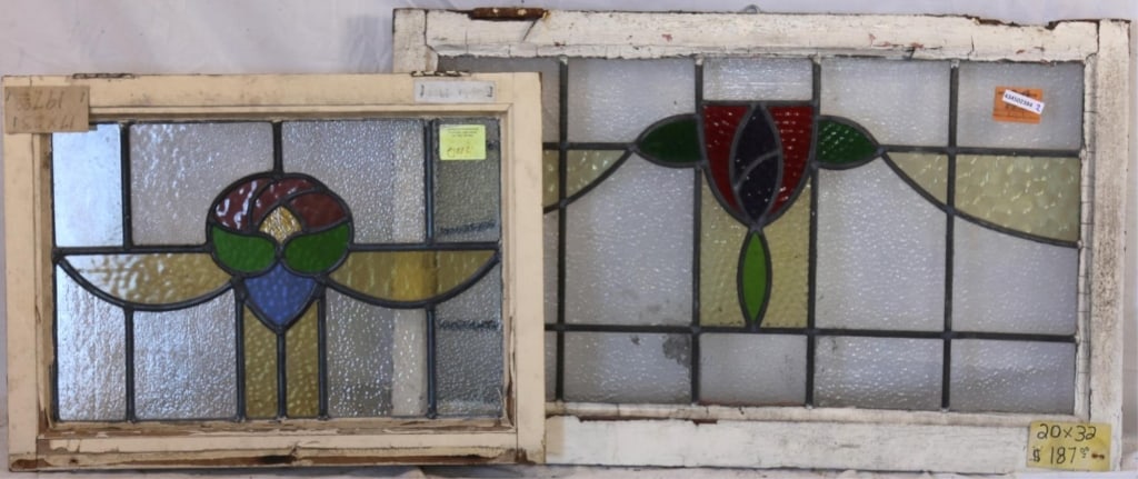 TWO CONTINENTAL STAINED GLASS PANELS: Two Continental stained glass panels with abstract floral medallions in multicolored stained glass. Approximate dimensions: h. 20", w. 32" Disclaimer: This is an online court ordered bankruptcy sale.
