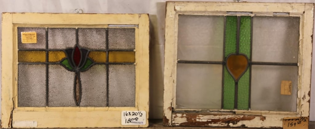 TWO ANTIQUE CONTINENTAL STAINED GLASS PANELS: Two antique Continental stained glass panels with floral and heart-shaped medallions. Approximate dimensions: h. 20.5", w. 17" Disclaimer: This is an online court ordered bankruptcy sale. Participatin