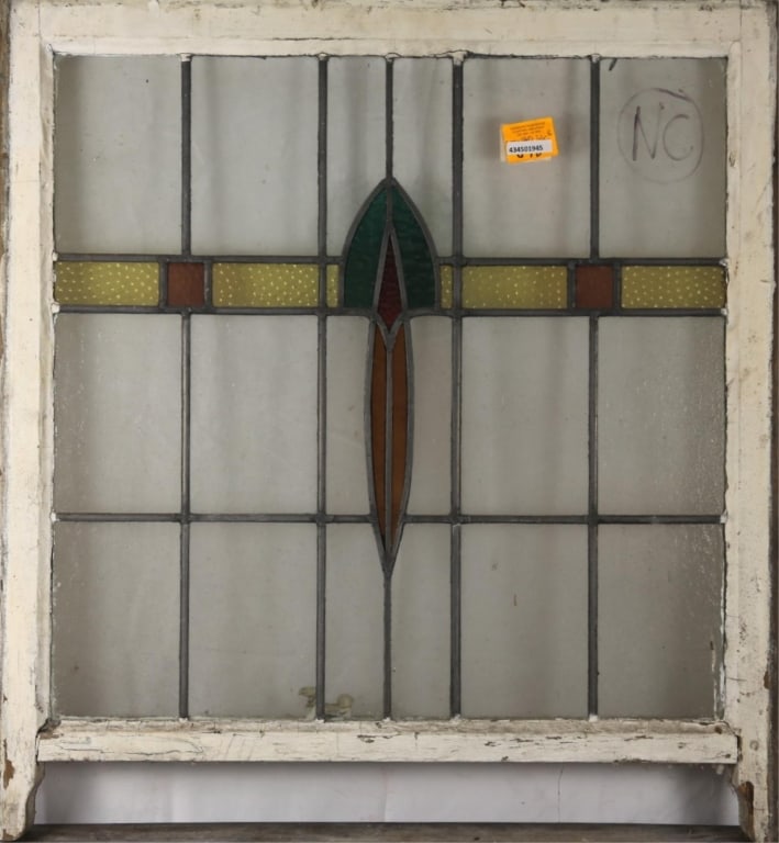 ENGLISH ART DECO STAINED GLASS PANEL: English Art Deco stained glass panel with green, red, and orange medallion and textured canary yellow details. Approximate dimensions: h. 33", w. 30" Disclaimer: This is an online court ordered bankru