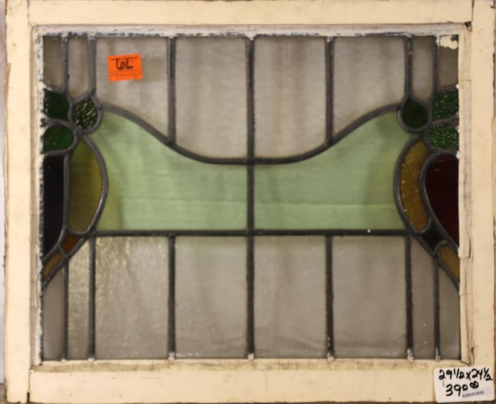 FRENCH ART NOUVEAU STAINED GLASS PANEL: French Art Nouveau stained glass panel with multicolored floral motif stained glass elements. Approximate dimensions: h. 24.5", w. 29.5" Disclaimer: This is an online court ordered bankruptcy sale. Pa