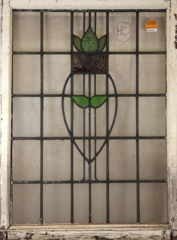 CONTINENTAL ART NOUVEAU STAINED GLASS PANEL: Continental Art Nouveau stained glass panel with floral medallion and purple wispy glass details. Approximate dimensions: h. 42", w. 30.5" Disclaimer: This is an online court ordered bankruptcy sale.