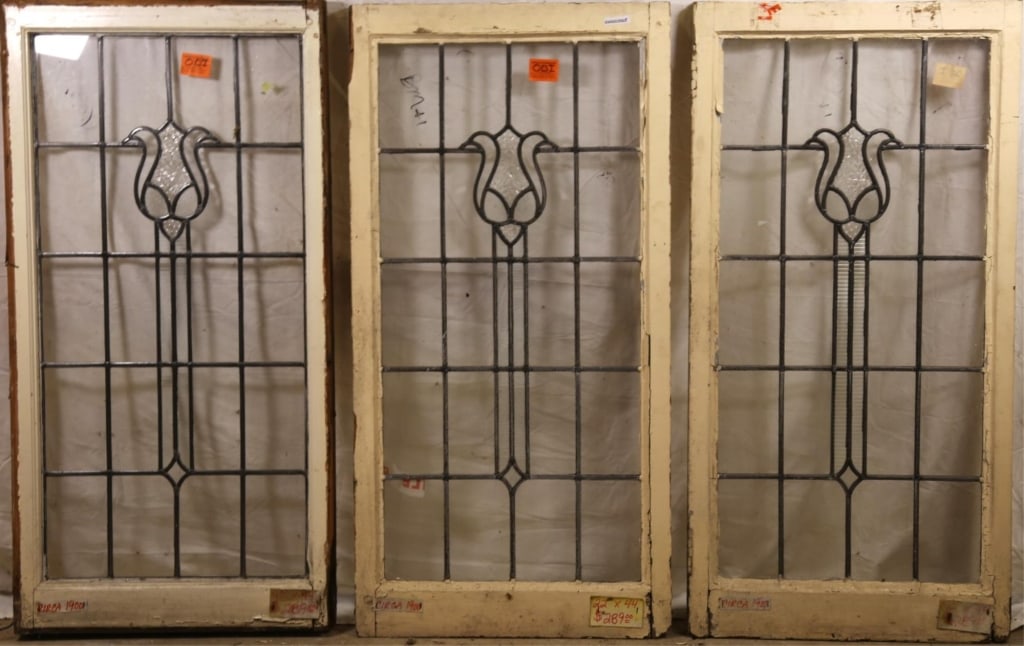 SET OF 3 ANTIQUE FRENCH LEADED GLASS PANELS: Set of three antique French leaded glass panels with floral motif and textured colorless leaded glass panel accents. Approximate dimensions: h. 22", w. 44" Disclaimer: This is an online court ordered 