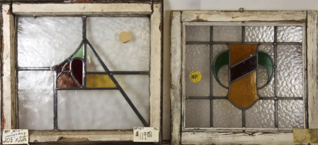 TWO ENGLISH ART DECO STAINED GLASS PANELS: Two English Art Deco stained glass panels, one with abstract geometric medallion, another with shield-form medallion. Approximate dimensions: h. 22.5", w. 20.5" Disclaimer: This is an online court ord