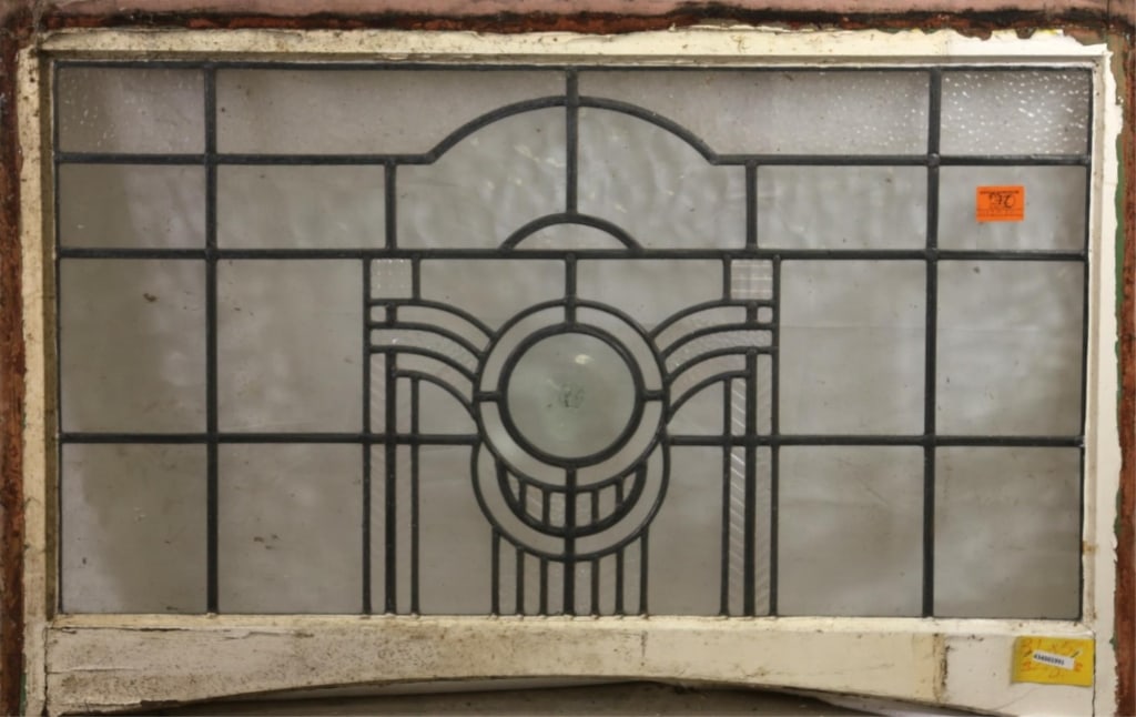 ANTIQUE LEADED STAINED GLASS PANEL: Antique leaded stained glass panel with a blown jeweled detail in the center. Approximate dimensions: h. 31", w. 50" Disclaimer: This is an online court ordered bankruptcy sale. Participating bidders