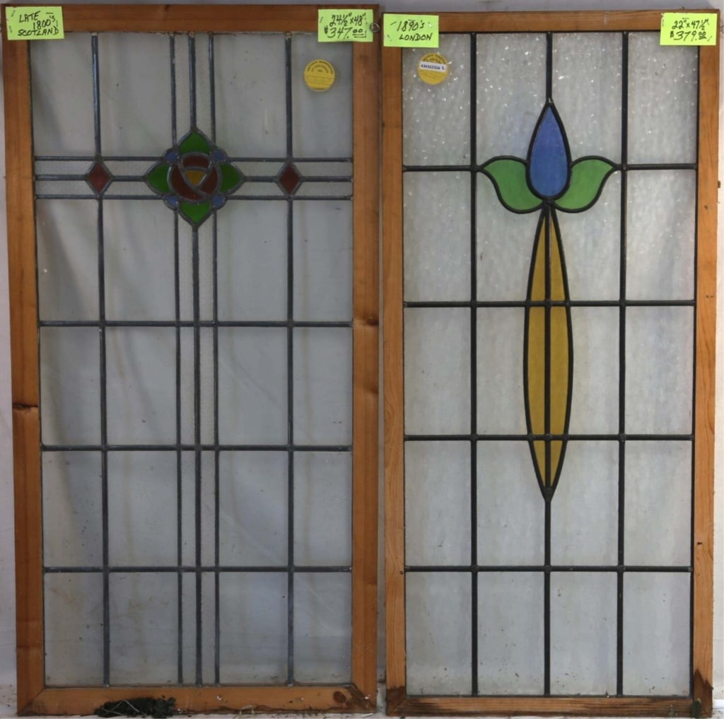TWO CONTINENTAL STAINED GLASS PANELS: Two Continental stained glass panels with multicolored stained glass accents. Approximate dimensions: h. 47.5", w. 22" Disclaimer: This is an online court ordered bankruptcy sale. Participating bidder
