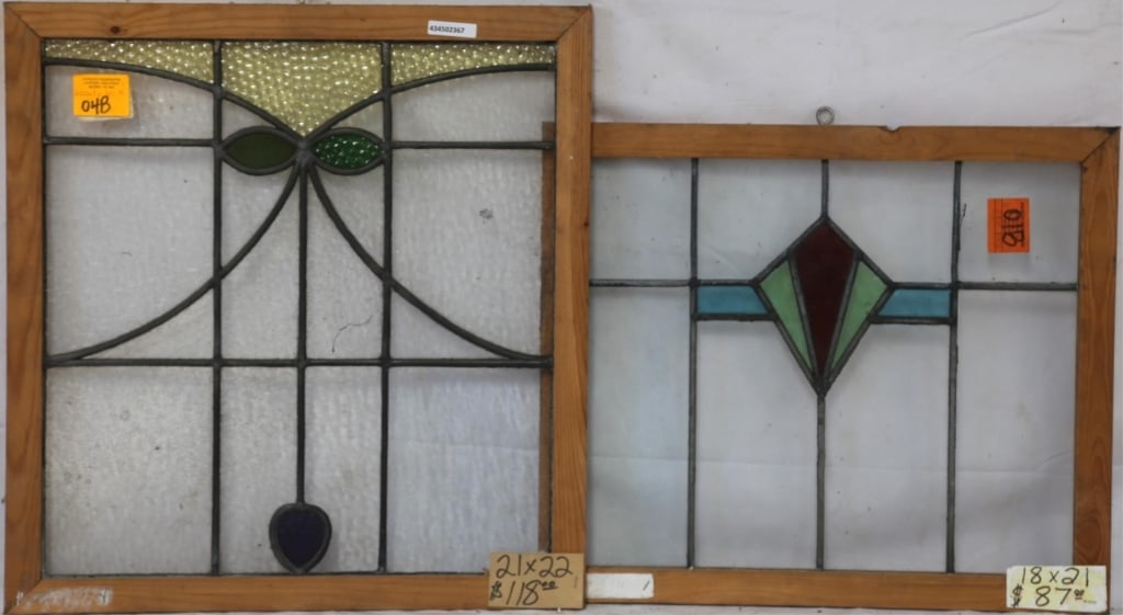 TWO ENGLISH STAINED GLASS PANELS: Two English stained glass panels with elaborate multicolored stained glass elements. Approximate dimensions: h. 22", w. 21" Disclaimer: This is an online court ordered bankruptcy sale. Participating b