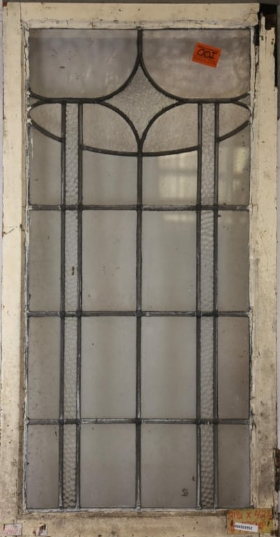 ANTIQUE CONTINENTAL LEADED GLASS PANEL: Antique Continental leaded glass panel with a floral motif and textured colorless leaded glass accents. Approximate dimensions: h. 42.5", w. 21.5" Disclaimer: This is an online court ordered bankruptc