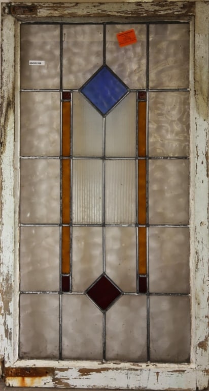 FRENCH ART DECO STAINED GLASS PANEL: French Art Deco stained glass panel with a multicolored geometric medallion. Approximate dimensions: h. 43", w. 23" Disclaimer: This is an online court ordered bankruptcy sale. Participating bidders m