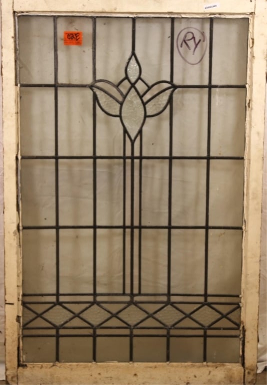 ANTIQUE CONTINENTAL LEADED GLASS PANEL: Antique Continental leaded glass panel with floral and geometric motif and textured colorless leaded glass panel accents. Approximate dimensions: h. 45", w. 29" Disclaimer: This is an online court ord