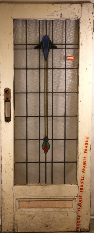 FRENCH ART DECO STAINED GLASS DOOR: French Art Deco stained glass door with blue, purple, green, and red central element, and colorless leaded glass panels. Approximate dimensions: h. 80", w. 32" Disclaimer: This is an online court orde
