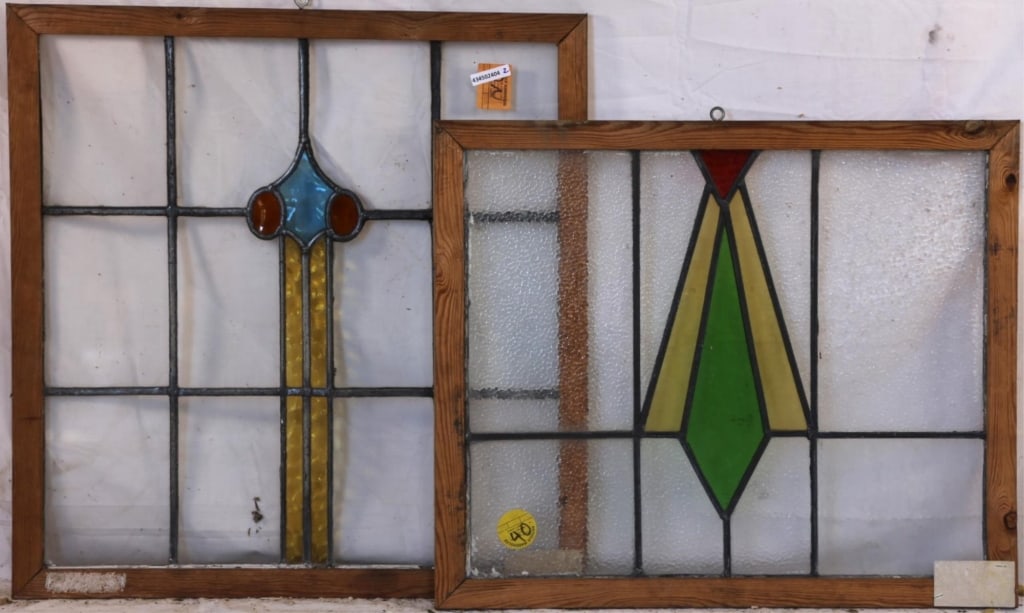 TWO CONTINENTAL STAINED GLASS PANELS: Two Continental stained glass panels with multicolored stained glass details. Approximate dimensions: h. 26", w. 25" Disclaimer: This is an online court ordered bankruptcy sale. Participating bidders
