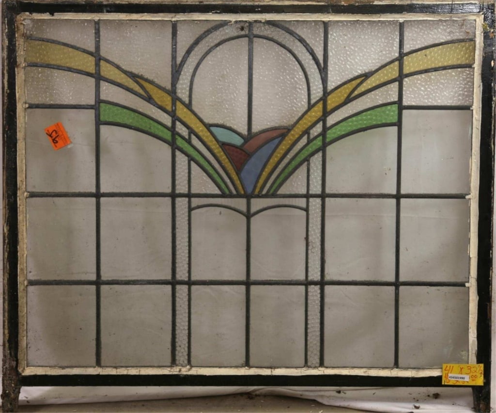 FRENCH ART DECO STAINED GLASS PANEL: French Art Deco stained glass panel with yellow and green textured stained glass accents. Approximate dimensions: h. 32.5", w. 41.5" Disclaimer: This is an online court ordered bankruptcy sale. Partic