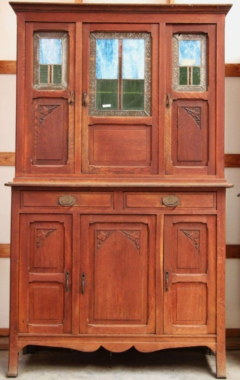 FRENCH ART DECO STAINED GLASS BUFFET: French Art Deco stained glass buffet with inset carved panels, blue wispy glass accents, and a carved apron. Approximate dimensions: h. 80.5", w. 50", d. 17.5" Disclaimer: This is an online court orde